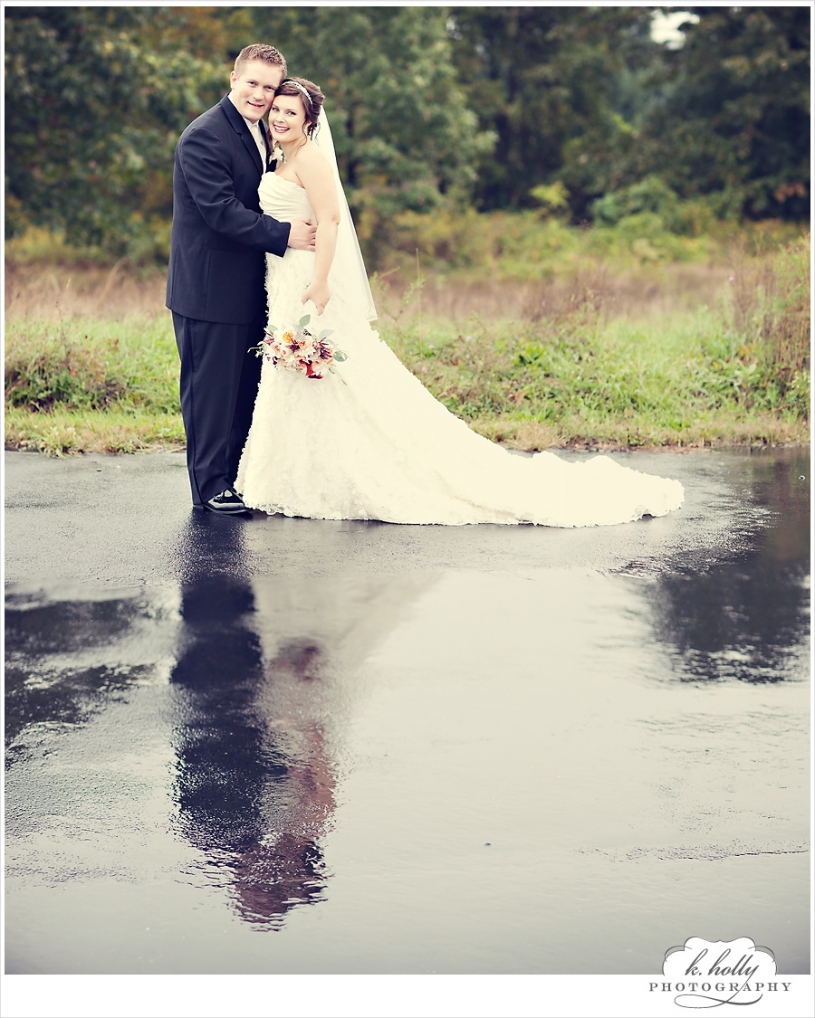 bride groom rain blacktop reflection water